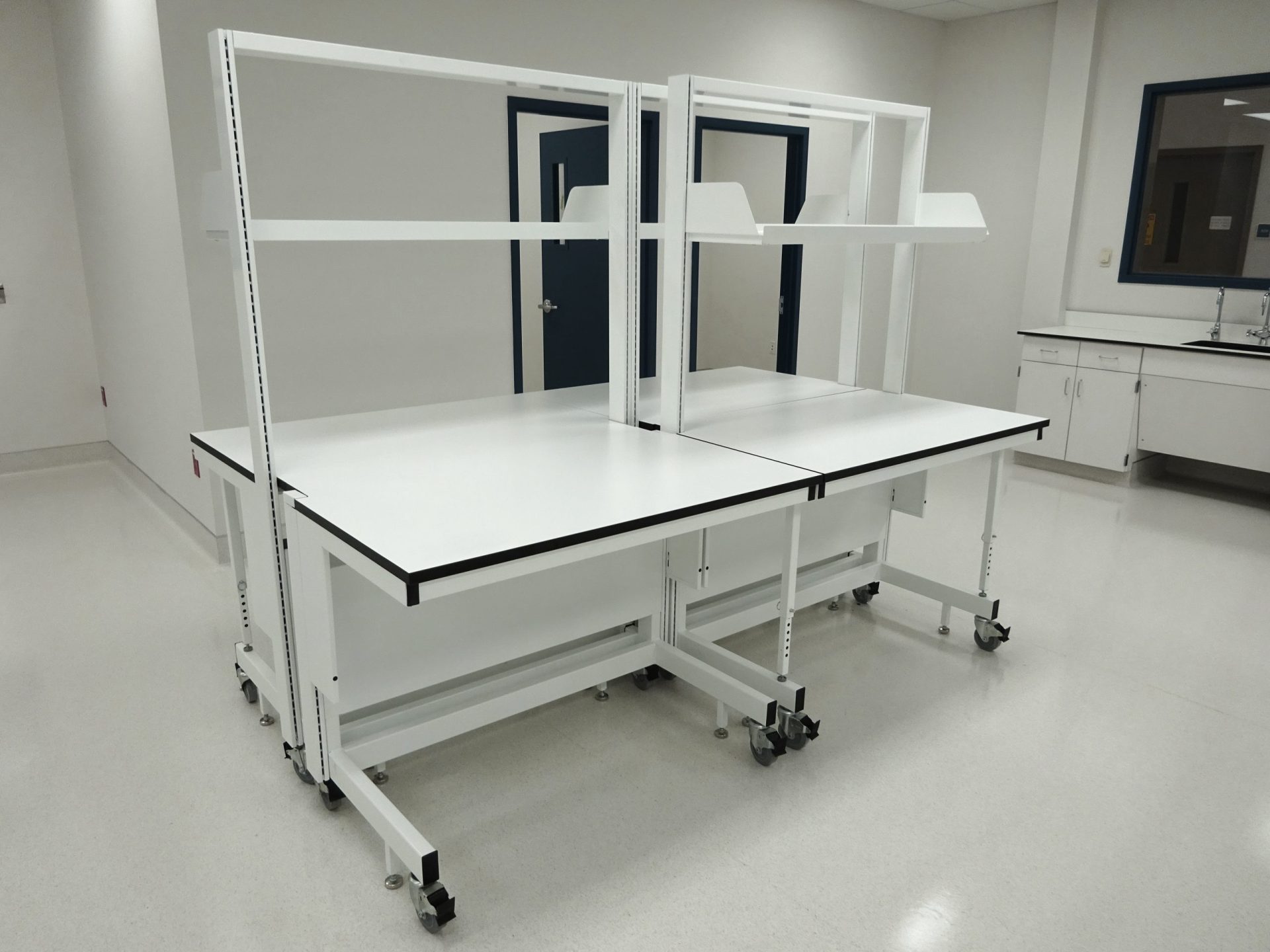 Full height Sigma Carts with fold down, adjustable height legs for extra load rating, in a lab