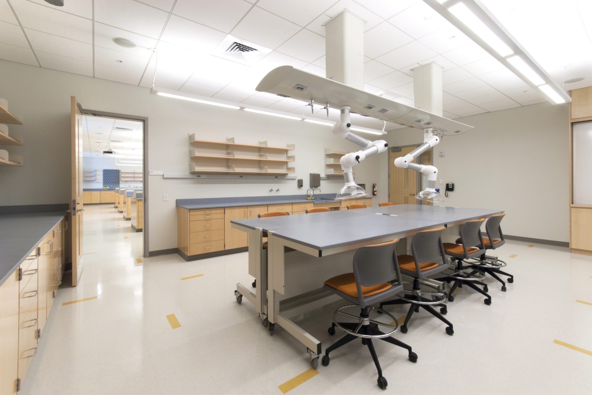 Low Sigma Carts with suspended cabinets, along with wood casework, in a lab