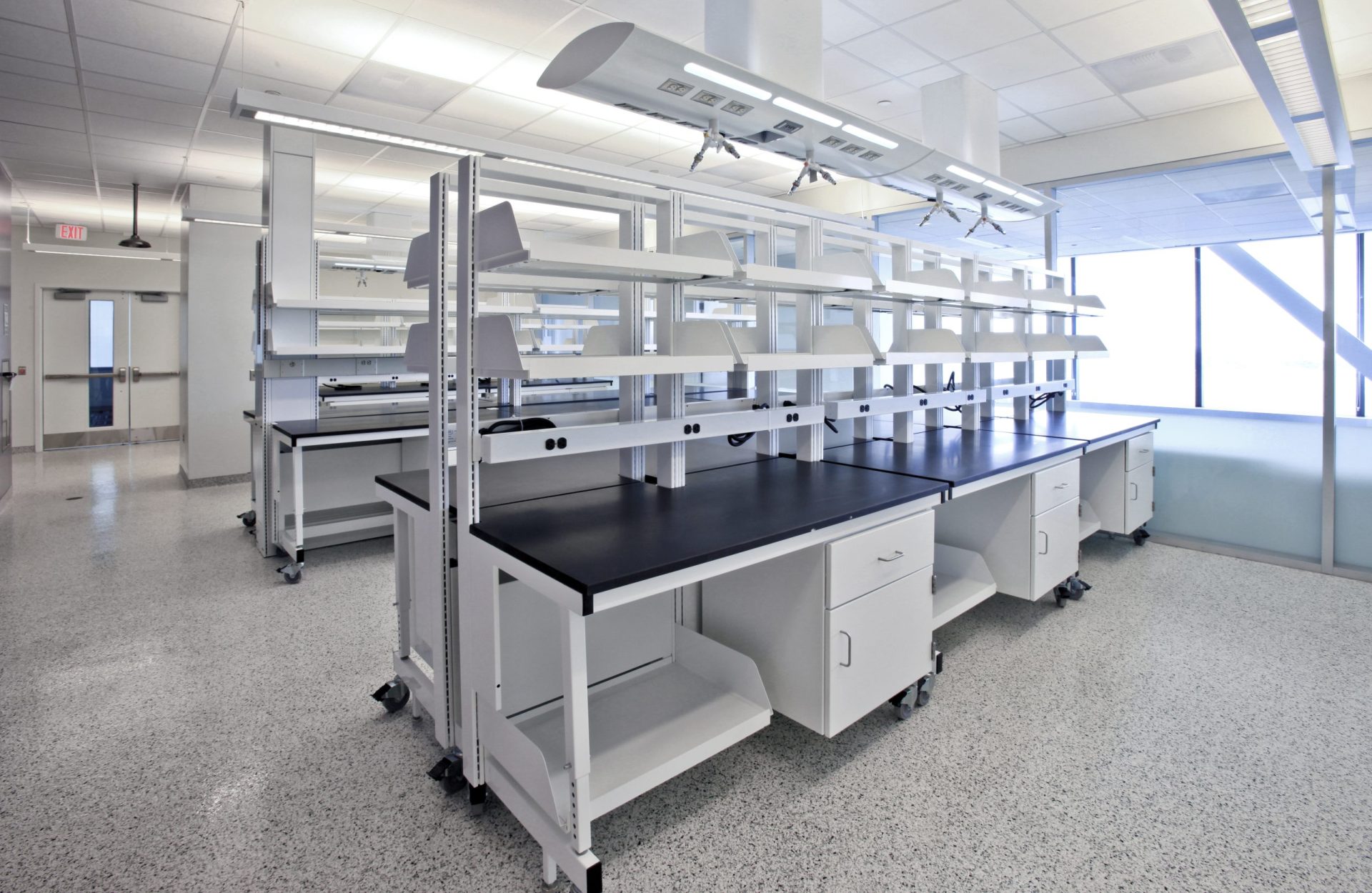 Sigma Carts with suspended cabinets and shelving, in a lab