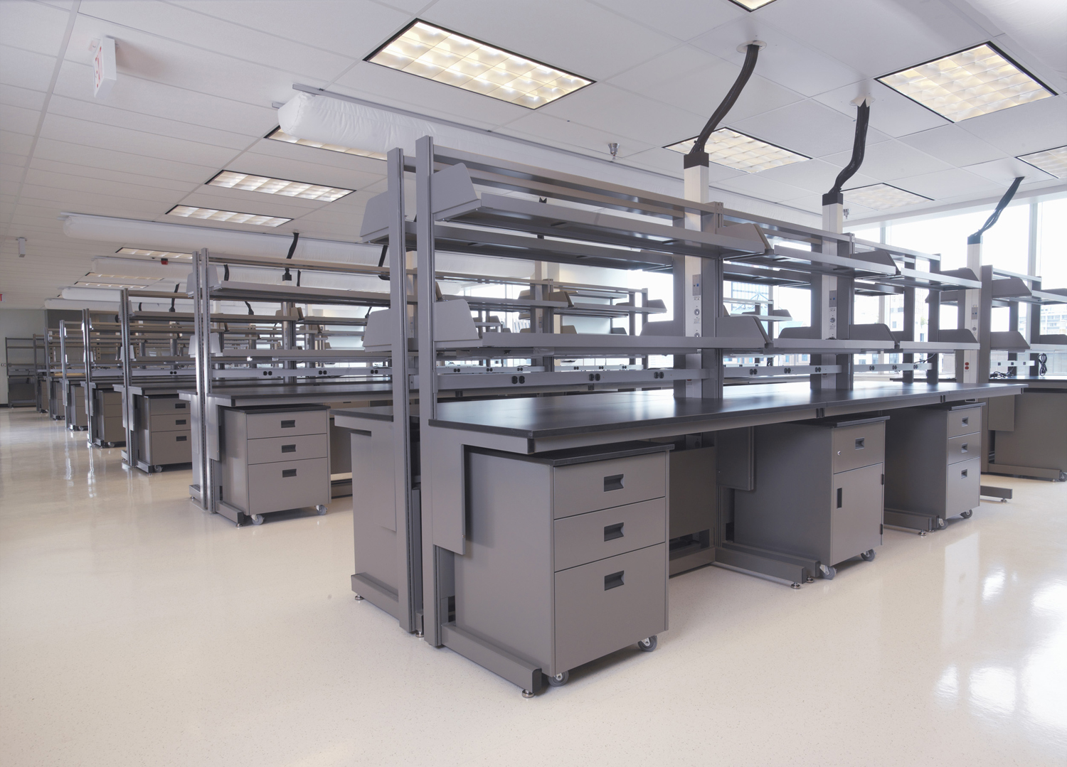 Carts with shelving and mobile cabinets, in a lab.